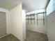 Walk-in closet featuring built-in wire shelving for efficient storage organization at 2315 Carroll Pl, Tampa, FL 33612
