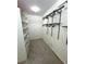Walk-in closet with custom white shelving and wire storage racks at 2315 Carroll Pl, Tampa, FL 33612