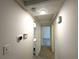 Hallway shot includes thermostat, light switches, and tile flooring with doors at 2315 Carroll Pl, Tampa, FL 33612
