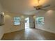 Bright living room featuring tiled floors, recessed lights, and a ceiling fan at 2315 Carroll Pl, Tampa, FL 33612
