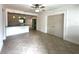 Open living room with tile floors and view of the kitchen with breakfast bar at 2315 Carroll Pl, Tampa, FL 33612