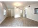 Bright living room featuring tiled floors, ceiling fan, and neutral walls at 2315 Carroll Pl, Tampa, FL 33612