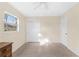 Bedroom featuring a closet, large window, with dresser for storage at 2418 N Links Ave, Sarasota, FL 34234
