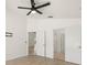 Spacious bedroom boasts wood-look floors, ceiling fan, and access to adjoining rooms at 29013 Old Marsh End, Wesley Chapel, FL 33543