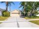Charming single-story home boasting mature landscaping and a large driveway at 29013 Old Marsh End, Wesley Chapel, FL 33543