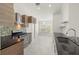 Modern kitchen with stainless steel appliances, designer cabinets, and tile backsplash at 29013 Old Marsh End, Wesley Chapel, FL 33543