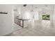 Bright living space with tile flooring, high ceilings, and sliding doors to the backyard at 29013 Old Marsh End, Wesley Chapel, FL 33543
