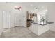 Open concept kitchen and living area with lots of natural light and tiled floors at 29013 Old Marsh End, Wesley Chapel, FL 33543