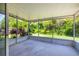 Spacious screened porch offering peaceful views of the lush backyard at 29013 Old Marsh End, Wesley Chapel, FL 33543