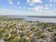 Expansive aerial shot of the community highlighting the neighborhood's layout and the stunning lake backdrop at 2974 Sean Way, Palm Harbor, FL 34684