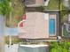 Birds-eye view featuring a house with pool, driveway, roof, and landscaping at 2974 Sean Way, Palm Harbor, FL 34684