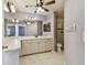 Bathroom featuring a vanity with cabinets and a tile shower with glass doors and a toilet at 2974 Sean Way, Palm Harbor, FL 34684