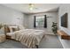 Cozy bedroom featuring a comfortable bed with a headboard, shelves, and a window at 2974 Sean Way, Palm Harbor, FL 34684