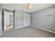 Bedroom featuring neutral walls, carpeted floors, a window, and closet doors at 2974 Sean Way, Palm Harbor, FL 34684