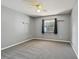 Bedroom featuring neutral walls, carpeted floors, a window, and ample space at 2974 Sean Way, Palm Harbor, FL 34684