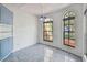 Dining room featuring tile floors, modern lighting and arched windows at 2974 Sean Way, Palm Harbor, FL 34684