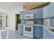 Kitchen featuring stainless appliances, subway tile backsplash and white counter tops at 2974 Sean Way, Palm Harbor, FL 34684
