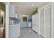 Open kitchen featuring tile floors and ample cabinet space at 2974 Sean Way, Palm Harbor, FL 34684