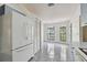 Open kitchen with tile floors, arched windows and ample natural light at 2974 Sean Way, Palm Harbor, FL 34684