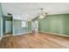 Open living room boasts wood floors, fan and neutral paint at 2974 Sean Way, Palm Harbor, FL 34684