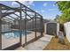 Enjoy the convenience of a backyard shed, adjacent to the screened-in pool area, for storing pool and garden supplies at 2974 Sean Way, Palm Harbor, FL 34684