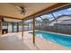The in-ground pool is surrounded by a screened enclosure, providing a perfect retreat at 2974 Sean Way, Palm Harbor, FL 34684