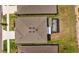 Aerial view of a single Gathering home with screened-in patio and lush green landscaping at 33645 Elm Hill Br, Wesley Chapel, FL 33545