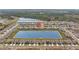 Aerial view of a community with homes surrounding a lake, emphasizing the neighborhood's location at 33645 Elm Hill Br, Wesley Chapel, FL 33545