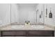 Bathroom featuring double sinks, granite countertop, vanity, and decor at 33645 Elm Hill Br, Wesley Chapel, FL 33545