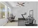 Bright bonus room provides a versatile space for a home office and fitness, enhanced by natural light and modern amenities at 33645 Elm Hill Br, Wesley Chapel, FL 33545
