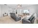 Open-concept living room with neutral carpet, modern furniture, and recessed lighting at 33645 Elm Hill Br, Wesley Chapel, FL 33545
