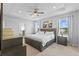Main bedroom with trey ceilings, plush carpet and ensuite bath access at 33645 Elm Hill Br, Wesley Chapel, FL 33545
