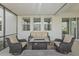 Relaxing patio features comfortable seating around a modern fire pit table, perfect for outdoor gatherings at 33645 Elm Hill Br, Wesley Chapel, FL 33545