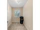 Office with neutral walls, a ceiling fan, a large window, and printer at 3710 W Tacon St, Tampa, FL 33629