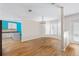 Bright dining area featuring wood floors, large bay window, and access to the kitchen at 3710 W Tacon St, Tampa, FL 33629