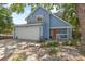 Charming two-story blue home with large driveway and landscaping at 3710 W Tacon St, Tampa, FL 33629
