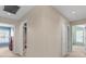 Upstairs hallway with neutral paint, carpet, and several closets at 3710 W Tacon St, Tampa, FL 33629