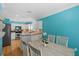 Bright kitchen with a dining area. White cabinets and stone countertops are featured at 3710 W Tacon St, Tampa, FL 33629