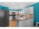 Bright kitchen with stainless steel appliances, granite countertops, and hardwood floors at 3710 W Tacon St, Tampa, FL 33629