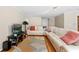 Bright living room with hardwood floors, a large sofa, and a modern entertainment center at 3710 W Tacon St, Tampa, FL 33629