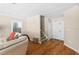 Inviting living room with hardwood floors, a neutral color palette, and staircase at 3710 W Tacon St, Tampa, FL 33629