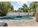 Relaxing backyard pool area with a decorative fountain and lovely brick pavers at 3710 W Tacon St, Tampa, FL 33629