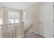 Stairwell with carpet and railing leading to a bright upstairs area at 3710 W Tacon St, Tampa, FL 33629