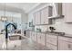 Contemporary kitchen featuring granite countertops, stainless steel appliances, and ample cabinet space at 4396 Night Star Trl, Odessa, FL 33556