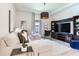 Bright and comfortable living room featuring stylish furnishings, modern decor, and ample natural light at 4396 Night Star Trl, Odessa, FL 33556