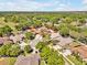 Aerial view of property showcasing lush green trees, well-maintained homes and serene surroundings at 4419 Swift Cir, Valrico, FL 33596