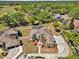 Expansive property displaying lush landscaping, a screened pool, and a lengthy circular driveway at 4419 Swift Cir, Valrico, FL 33596