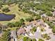 Aerial view of a golf community showcasing residences with pools, solar panels, and well-maintained landscaping at 4419 Swift Cir, Valrico, FL 33596
