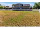 Expansive backyard enclosed by a pristine white fence, offering ample space for outdoor activities at 4419 Swift Cir, Valrico, FL 33596