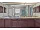 Bright bathroom boasting a dual vanity with granite countertops, stylish mirrors, and marble accents at 4419 Swift Cir, Valrico, FL 33596